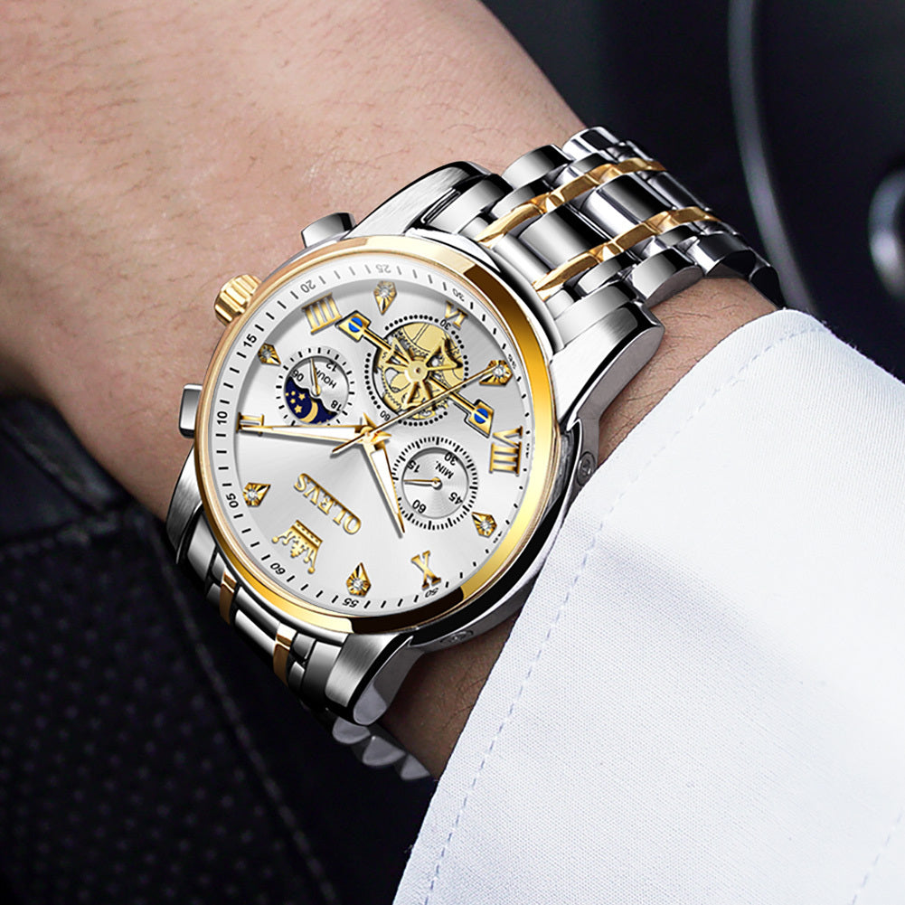 Luxury wristwatch with silver and gold band on a person's wrist.
